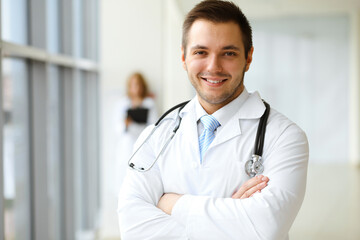 Male doctor standing in the modern clinic. Perfect medical service in the hospital. Medicine and healthcare concept