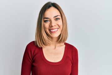 Fototapeta premium Young caucasian blonde woman wearing casual jumper with a happy and cool smile on face. lucky person.