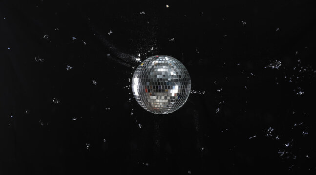 silver disco ball on black background