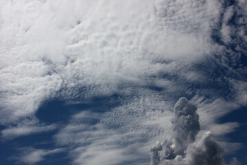 unusual shaped clouds on a blue sky background