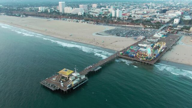 Aerial: Santa Monica Pier at sunset, Los Angeles, California, USA