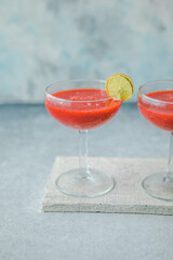 Strawberry daiquiri with a lime slice