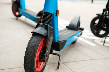 E-scooters parked in the sidewalk in London.