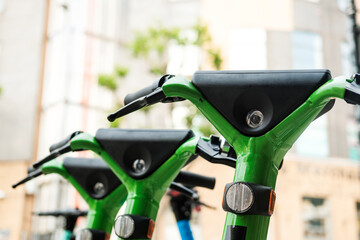 Group of E-scooters parked in the street in London.