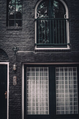 Black brick house with black windows 