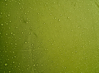 Water drops on waterproof membrane fabric. Morning dew on tent.