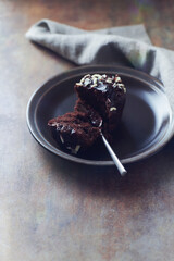 Choco Muffin on rustic stone background. Copy space. 