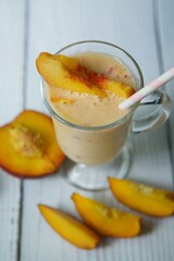 Cocktail or milk drink peach yogurt is poured into a glass bowl