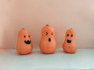 three smiling pumpkin