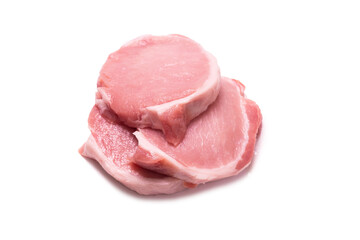 Raw pork pieces isolated on a white background.