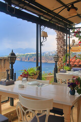 A table in a cozy cafe on the seashore.