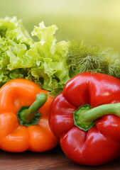 Colorful sweet bell peppers, salad, dill on wooden background.Healthy vegetarian food.Vegetarian eating concept. Copy space for text