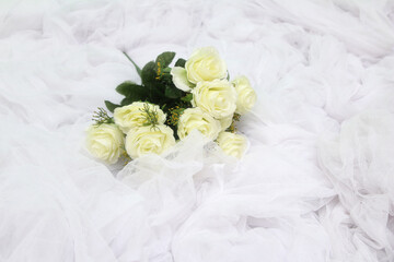 white rose on white cloth