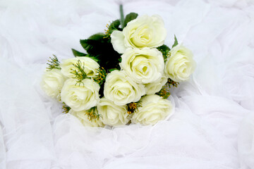 white rose on white cloth