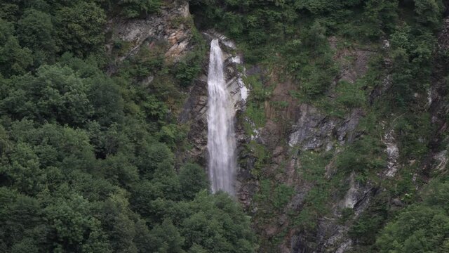 Static shot of gigantic Waterfall in Mesocco, Ticino, Switzerland, slow motion.
