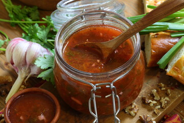 Georgian tkemali sauce on a wooden table