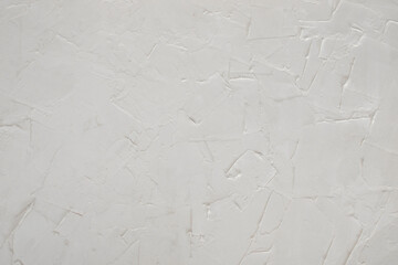 White textured uneven wall. White painted wall surface