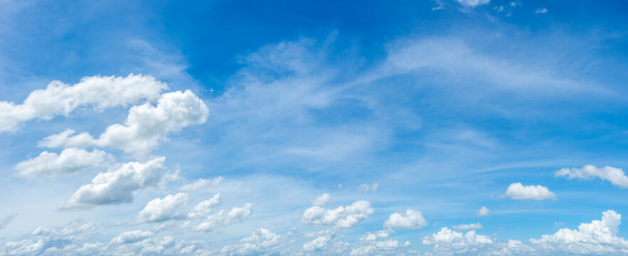 many white clouds in the blue sky	