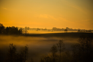 Fototapeta na wymiar A beautiful landscape of a misty morning during summer. Summertime scenery of Northern Europe.