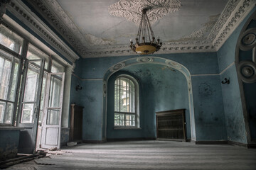 A beautiful room with shabby walls in an old abandoned house. Abandoned haunted manor. Ancient architecture and interiors. - Powered by Adobe
