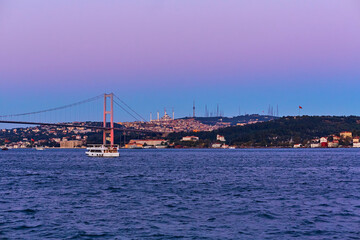 Evening boat trip on the Bosphorus in Istanbul. Bosphorus Bridge, in the night lights