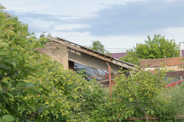 The wall of an old clay house - almost completely demolished