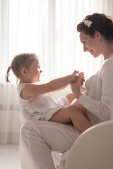 Pregnant mother with  daughter