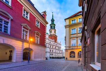 Fototapeta premium Empty street and Poznan Town Hall in Old Town at sunrise, Poznan, Poland