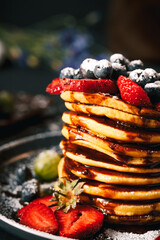 Pancake. Tasty pancakes with fruits, strawberries, berries, sugar. Pancakes with chocolate. Dessert. Breakfast pancakes. 
