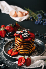 Obraz na płótnie Canvas Pancake. Tasty pancakes with fruits, strawberries, berries, sugar. Pancakes with chocolate. Dessert. Breakfast pancakes. 