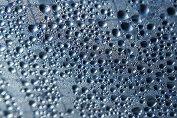 Water drops on a silver background. Abstract background