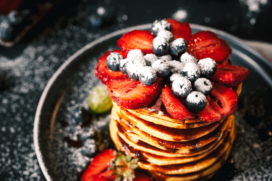 Pancake. Tasty pancakes with fruits, strawberries, berries, sugar. Pancakes with chocolate. Dessert. Breakfast pancakes. 
