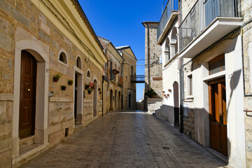 A narrow street between the old houses of Sant'Agata di Puglia, a medieval village in southern Italy.