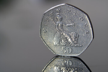 The British coin on the black background