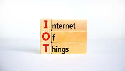 IOT, internet of things symbol. Wooden blocks with words IOT, internet of things on beautiful white background. Business, digital, IOT, internet of things concept.