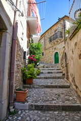 A narrow street between the old houses of Sant'Agata di Puglia, a medieval village in southern Italy.