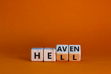 Hell or heaven symbol. Turned wooden cubes and changed the word 'hell' to 'heaven'. Business and...