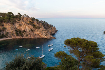 Fototapeta premium Remote and wild Mediterranean beach with boats