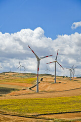 Wind turbines in the Apulian countryside in Italy.