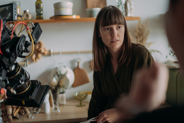 Director at work on the set. Shooting shift, equipment and group. Modern photography technique. © Anna