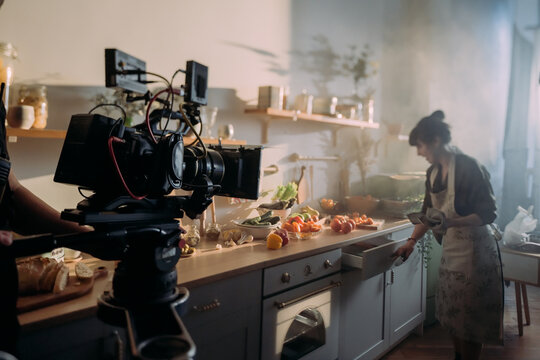 Professional cinema and video camera on the set. Shooting shift, lighting fixtures, shooting equipment and the team.