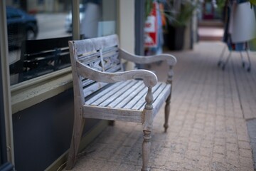 Handmade wooden bench outside of a local store