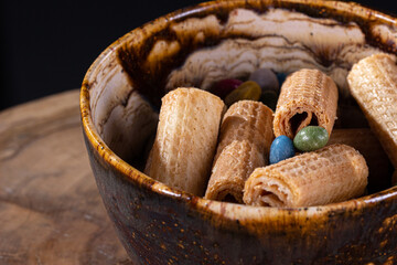 a plate of chocolates beautiful plate on a dark background, close-up