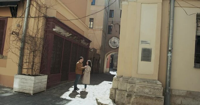 Sweet couple have vacation in old european town. Happy young lovers enjoy time spending together