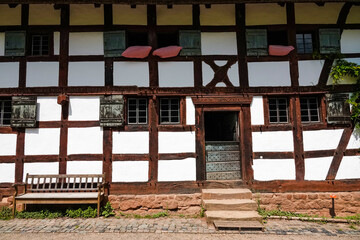 Fototapeta na wymiar Old house facade with old wooden windows and doors