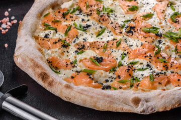 Tasty sliced pizza with seafood and tomato on black background