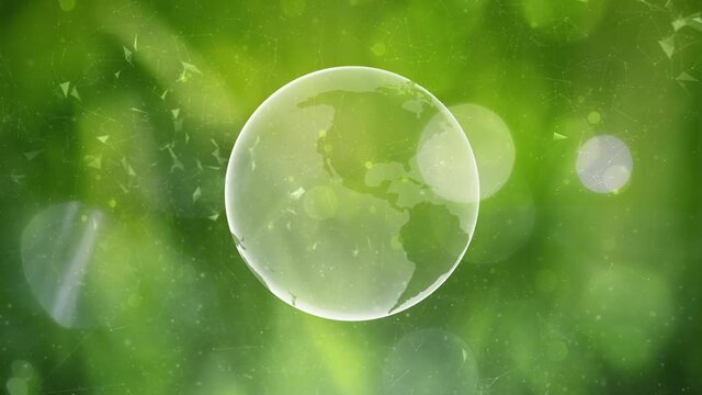 Green nature blurred copy space bokeh with glass effect earth globe rotation.