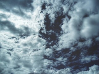 Clouds the sky metallic and darkened
