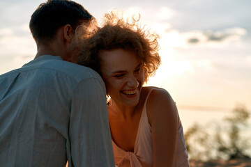 Portrait of laughing young woman and handsome man