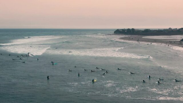 Aerial: Surfers on Malibu Lagoon State Beach, California, USA